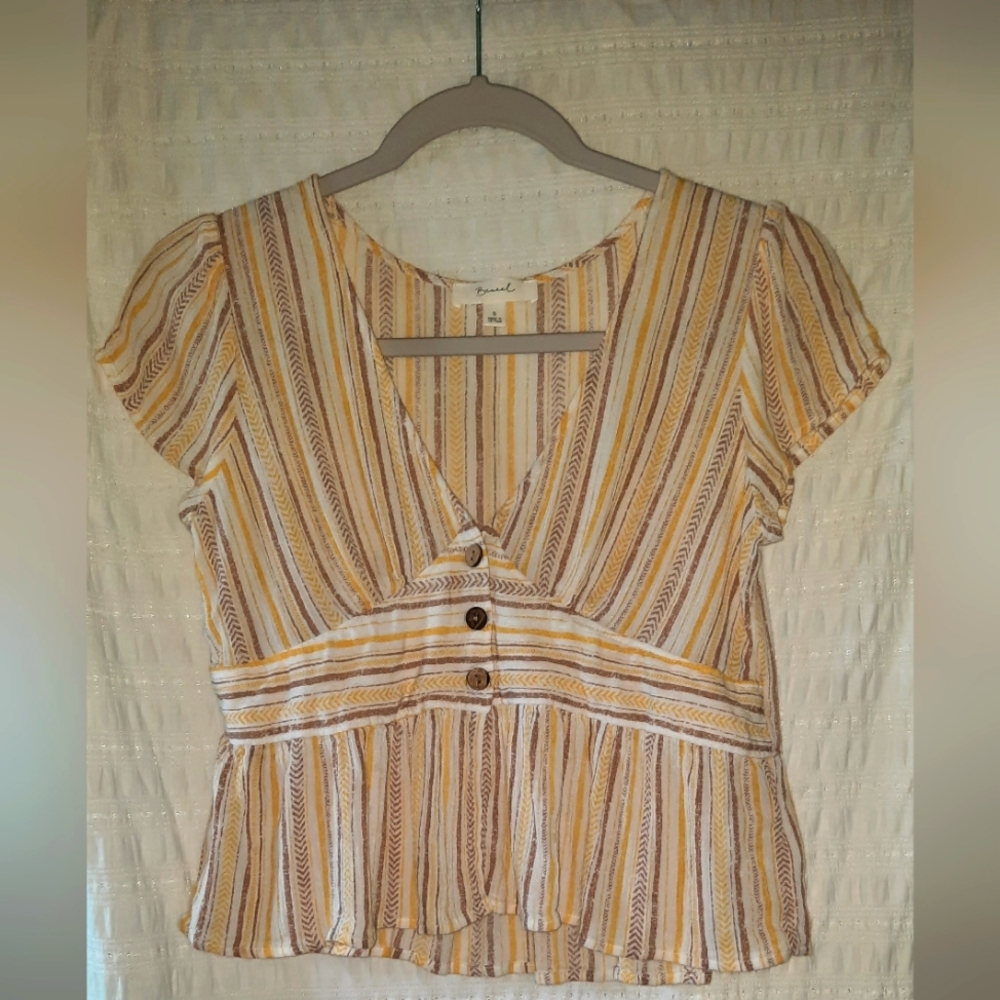 Cropped peplum-style blouse